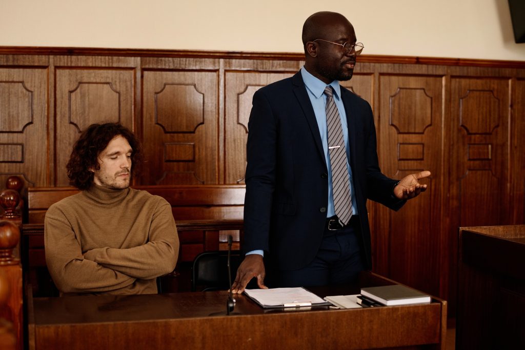 Confident African American male attorney explaining points of case to judge